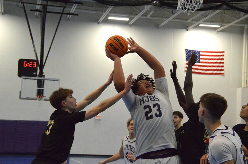 Rochelle's Brayden Harley goes up for two of his four points during the Hubs' sophomore basketball game with Sycamore.
