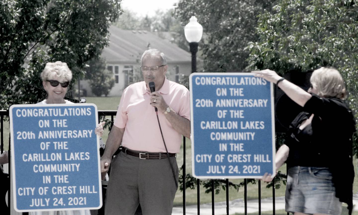 Ray Soliman, the mayor of Crest Hill, presented a city resolution proclaiming July 24, 2021, as  Carillon Lakes Day.  Pat Adams (left) and Karen Brown (right) from Carillon Lakes received the plaques.