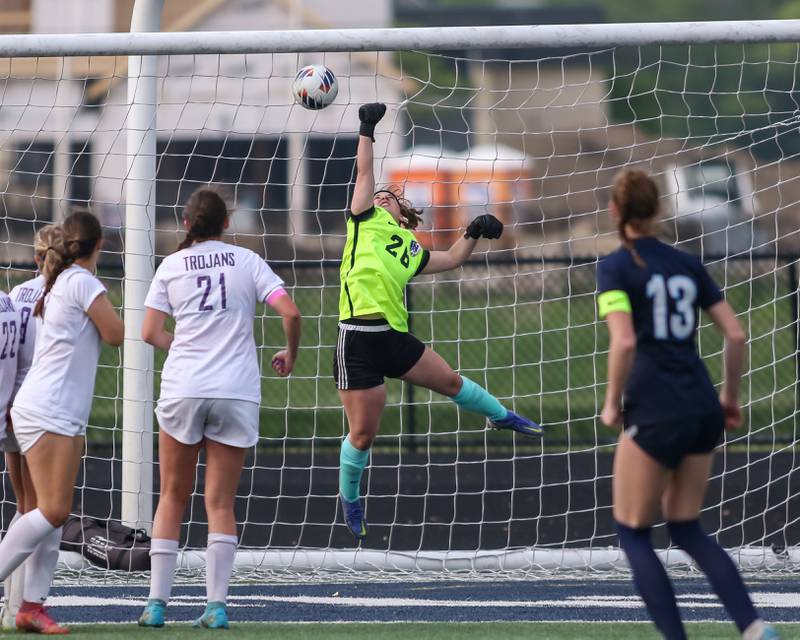 Downers Grove North's Elizabeth Reilly (1) leaps high for the block attempt of Downers Grove South's Emily Petring (13) goal kick Class 3A Addison Trail Regional final soccer match between Downers Grove South at Downers Grove North.  May 19, 2023.