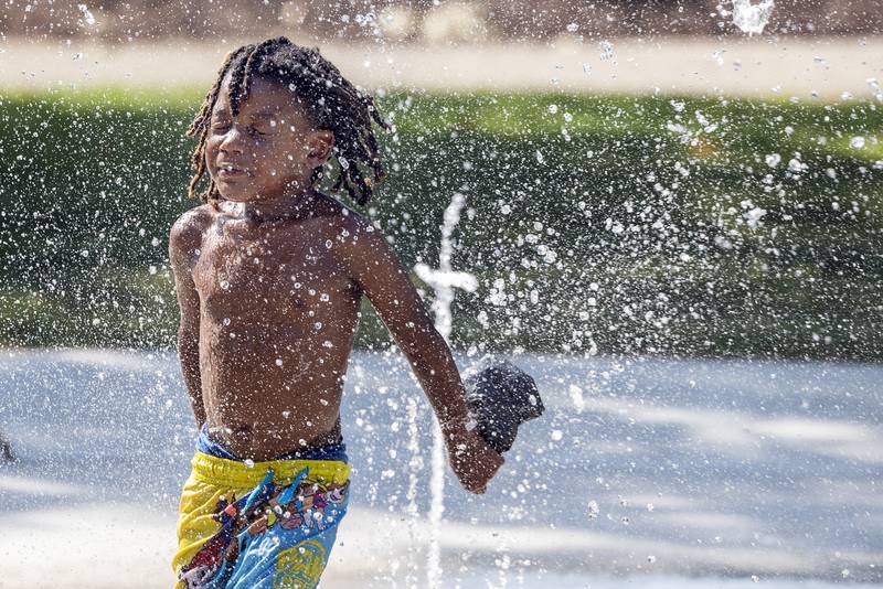 Ja’myree Jones, 5, cools down Wednesday, August 23, 2023 at the splash pad in Sterling.