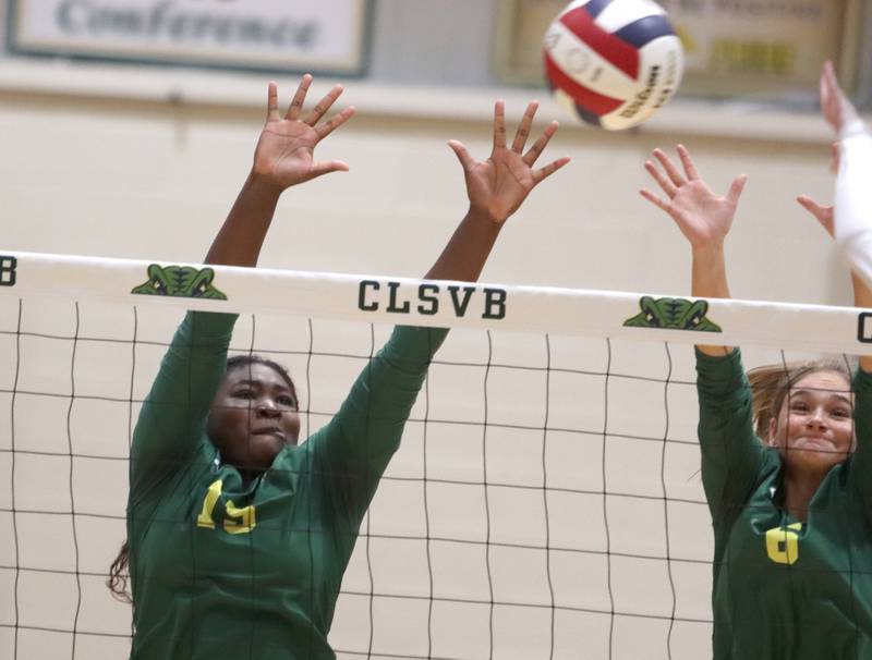 Crystal Lake South’s Sahara Okirika, left, and Bobbi Wire  block against Lakes in IHSA Class 3A Sectional semifinal volleyball action on Tuesday, Nov. 5, 2024, at  Crystal Lake South High School  in Crystal Lake.