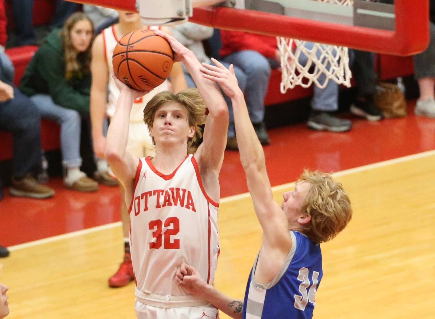 Ottawa's Aric Threadgill shoots a shot over Princeton's Noah Baker during the Dean Riley Shootin' The Rock Thanksgiving Tournament last season at Kingman Gym.