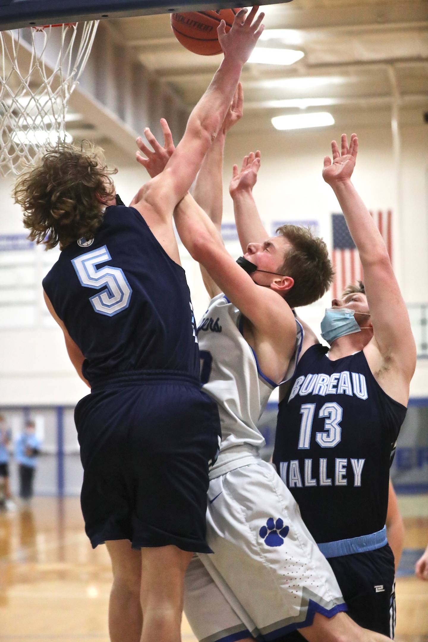 Bureau Valley's Carter Salisbury (5) and Nevin Bolin (13) double up Princeton's Mack Williams Tuesday night at Prouty Gym. The Tigers won 74-63.