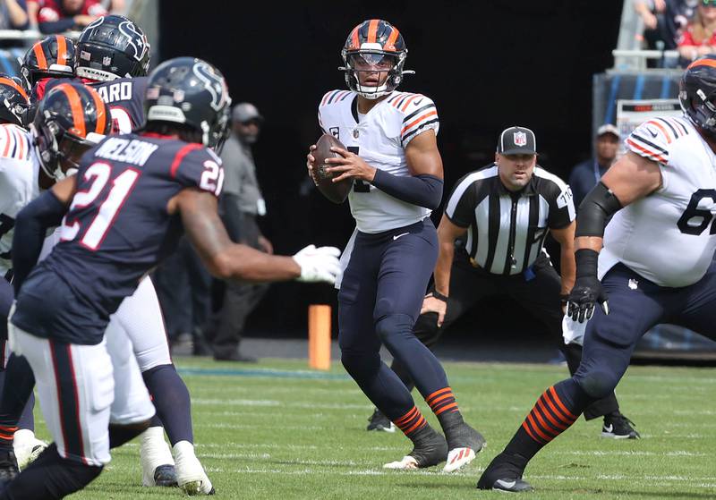Chicago Bears quarterback Justin Fields looks for a receiver in the Houston Texans secondary during their game Sunday, Sept. 25, 2022, at Soldier Field in Chicago.