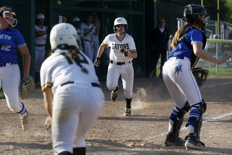 Crystal Lake South's Kennedy Grippo runs to home plate to score he winning run during a Fox Valley Conference softball game Monday, May 16, 2022, between Crystal Lake South and Burlington Central at Crystal Lake South High School.