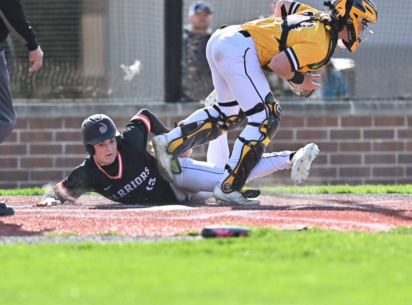 Lincoln-Way West's Tyler Bartley slides to home plate during the non-conference game against Joliet West on Friday, April. 19, 2024, at Joliet.