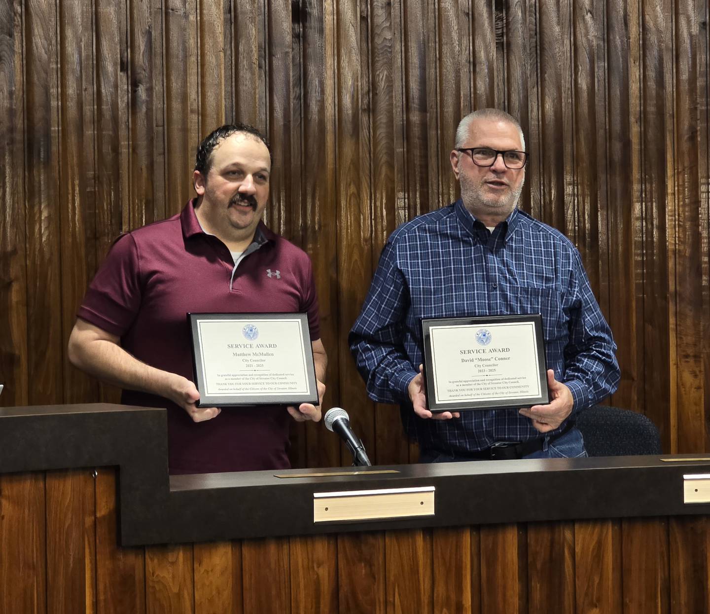 Matt McMullen (left) and David "Moose" Conner are honored with plaques Wednesday, May 7, 2025, for their time on the Streator City Council.