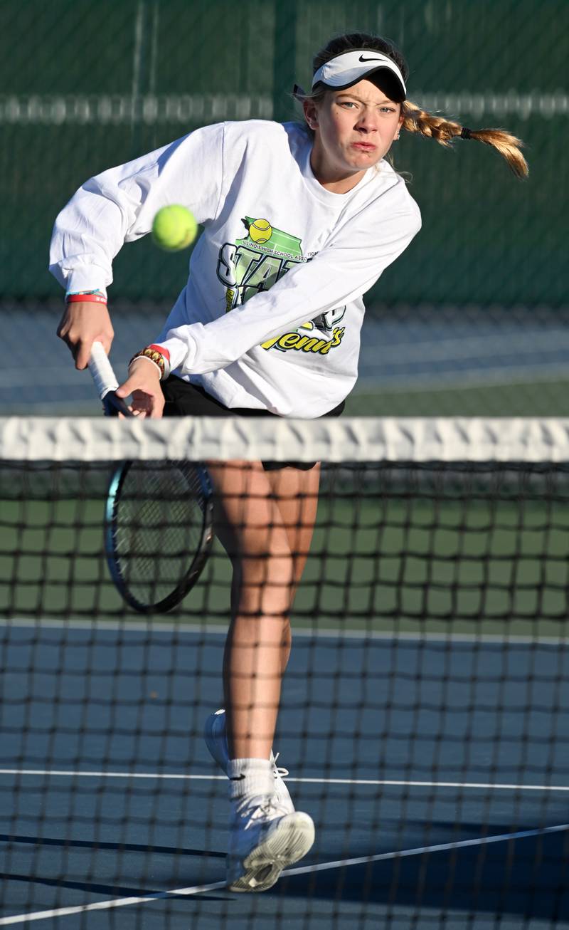 Hinsdale South's Addy Filipiak hustles to return the ball near the net during Class 1A singles third-place match of the girls state tennis tournament at Hersey High School on Saturday, Oct. 26, 2024 in Arlington Heights.