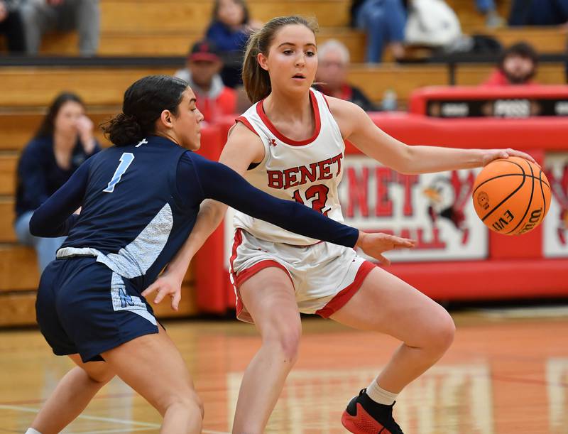 Benet’s Lindsay Harzich Protects the ball from the reach of Nazareth’s Allia Von Schlegell (1) during a game on January 29, 2025 at Benet Academy in Lisle.