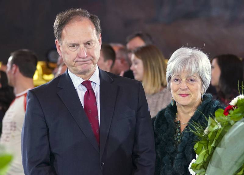 FILE - Supreme Court Justice Samuel Alito Jr., left, and his wife Martha-Ann Alito, pay their respects at the casket of Reverend Billy Graham at the Rotunda of the U.S. Capitol Building in Washington, Feb. 28, 2018. An upside-down American flag was displayed outside of Alito's home Jan. 17, 2021, days after former President Donald Trump supporters stormed the U.S. Capitol, The New York Times reports. It's a symbol associated with Trump's false claims of election fraud.  "It was briefly placed by Mrs. Alito in response to a neighbor's use of objectionable and personally insulting language on yard signs," Alito said in an emailed statement to the newspaper. (AP Photo/Pablo Martinez Monsivais, File)