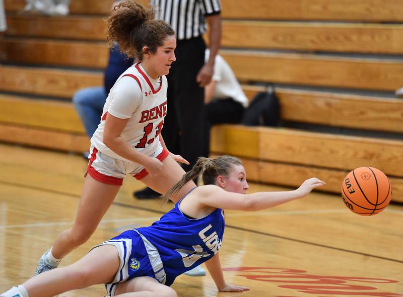 Lyons Township’s Avery Mezan reaches for a loose ball in front of Benet’s Macy Menendez during a game on November 18, 2025 at Benet Academy in Lisle.