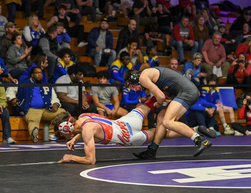 Grason Johnson of Yorkville Christian tries to keep a hold of Oregon wrestler  on Saturday Dec. 10th during the Plano Reaper wrestling classic held at Plano High School where he took first place.