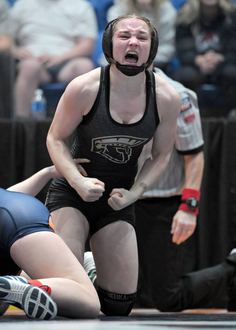 Sycamore’s Ema Durst reacts after pinning Isabella Miller of Oak Park River Forest in the 140-pound class at the girls wrestling state finals tournament at Grossinger Arena in Bloomington on Saturday, Feb. 28, 2026.