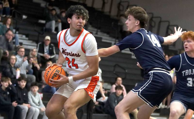 McHenry’s Adam Anwar looks for an option against Cary-Grove in varsity boys basketball on Tuesday, Feb. 17, 2026, at McHenry High School in McHenry.