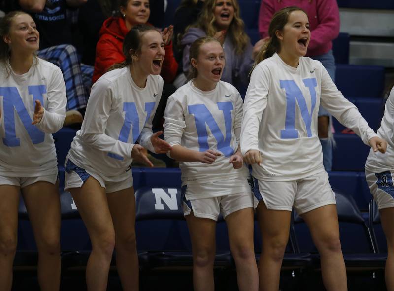 Nazareth's bench reacts to a basket during the girls varsity basketball game between Carmel High School and Nazareth Academy on Wednesday, Dec. 7, 2022 in LaGrange, IL.