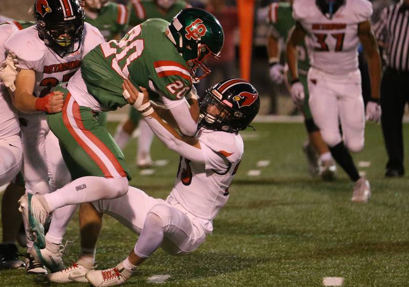 L-P's Griffin May is brought down by Metamora's Grady Neal on Friday, Sept. 5, 2025 at Howard Fellows Stadium.
