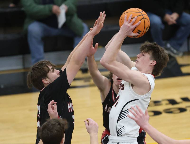 Woodland's Nate Berry eyes the hoop over Henry-Senachwine during the Tri-County Conference Tournament on Monday, Jan. 26, 2026 at Putnam County High School