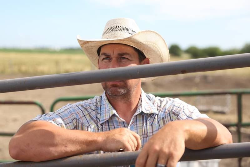 Former bull rider, now coach, Matt Wright waits to start his training with Dominic Dubberstine-Ellerbrock and other students. Dominic will be competing in the 2022 National High School Finals Rodeo Bull Riding event on July 17th through the 23rd in Wyoming. Thursday, June 30, 2022 in Grand Ridge.