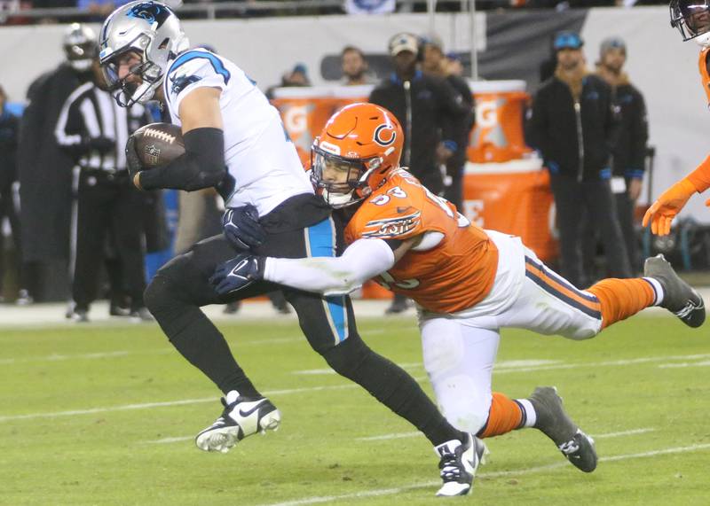 Chicago Bears line backer TJ. Edwards brings down Carolina Panthers wide receiver Adam Thielen on Thursday, Nov. 9, 2023 at Soldier Field.