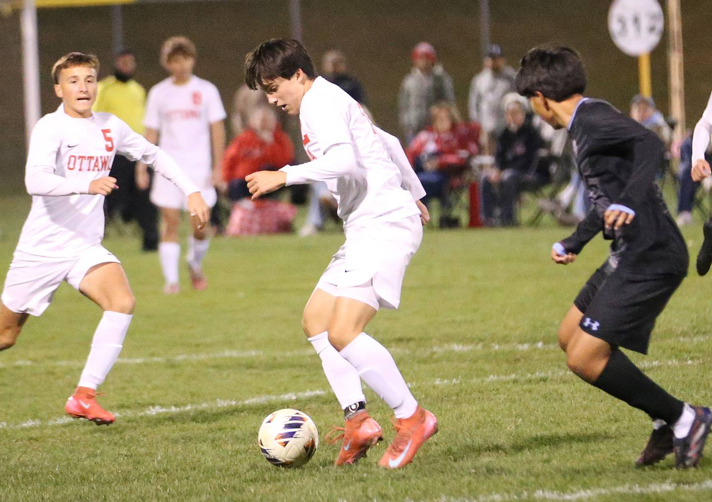 Ottawa's Luca Fernandez passes the ball to teammate Rory Moore as Kankakee's Luisangel Pereda defends during the Class 2A Regional semifinal game on Monday, Oct. 20, 2025 at Ottawa HIgh School.