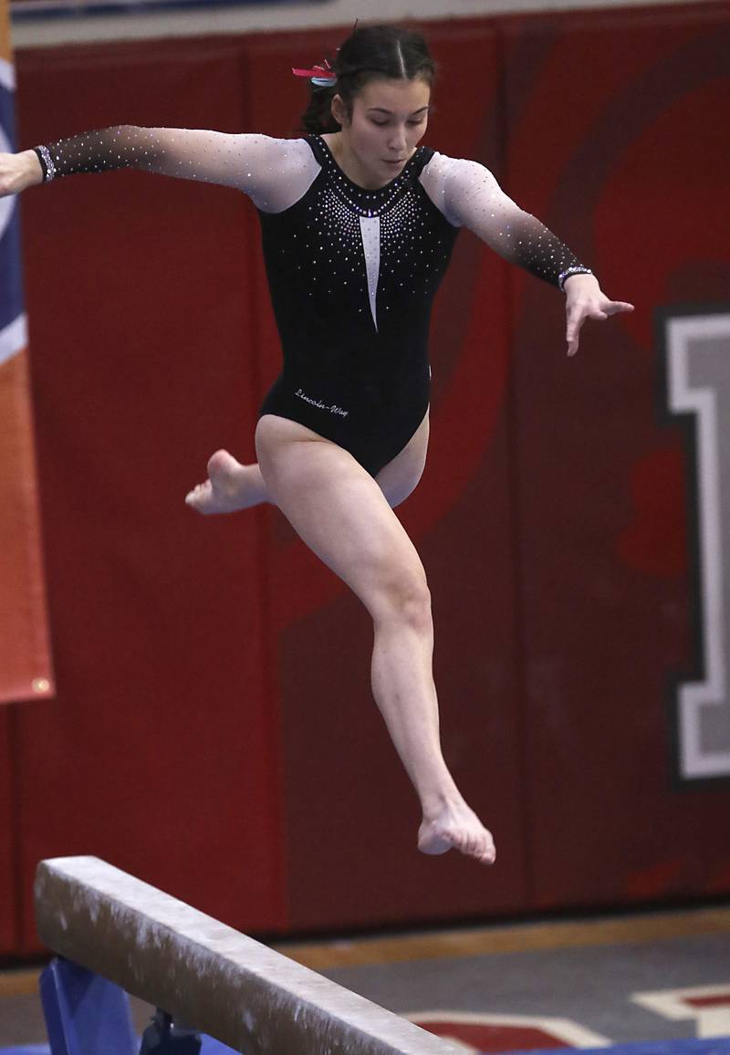 Lincoln-Way East’s Alivia Alaina Lekki competes in the preliminary round of the balance beam Friday, Feb. 17, 2023, during the IHSA Girls State Final Gymnastics Meet at Palatine High School.