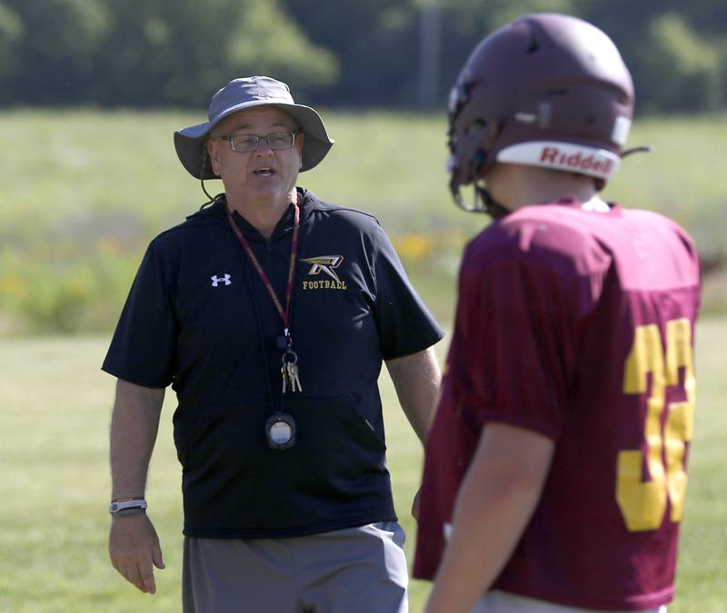 Richmond-Burton coach Mike Noll talks to Steven Siegel during summer football practice Thursday, July 14, 2022, at Richmond-Burton High School in Richmond.