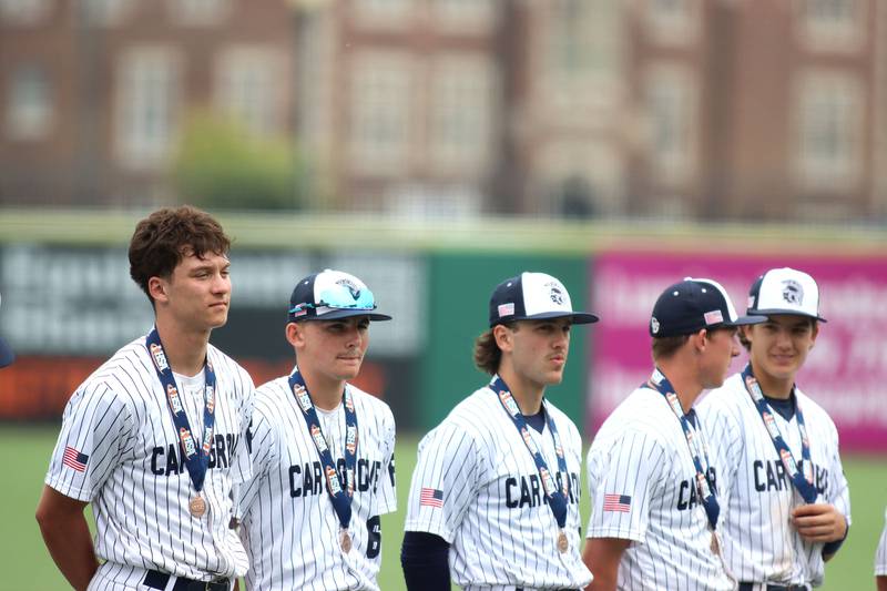 Cary-Grove’s Trojans stand with their medals after falling to Triad in IHSA Class 3A Third Place Game baseball action at Slammer Stadium in Joliet on Saturday, June 14, 2025.