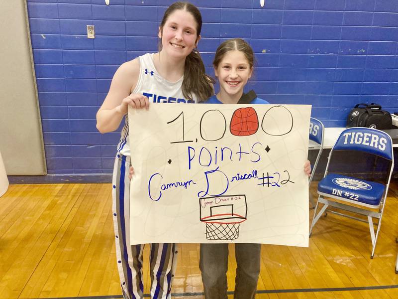 Princeton senior Camryn Driscoll had her fan club, including her sister, Lauren, watching as she scored her 1,000-point with 17 points to lead the Tigresses to a 54-17 win over Henry-Senachwine in Monday's season opener at Prouty Gym.