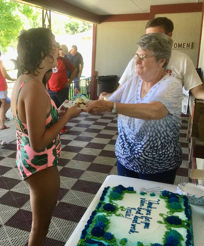 Rosie Rieuf served the cake Sunday, July 10, 2022, provided for the dedication of the Marseilles community swimming pool in honor of her and her late husband, Jim, for saving the facility.