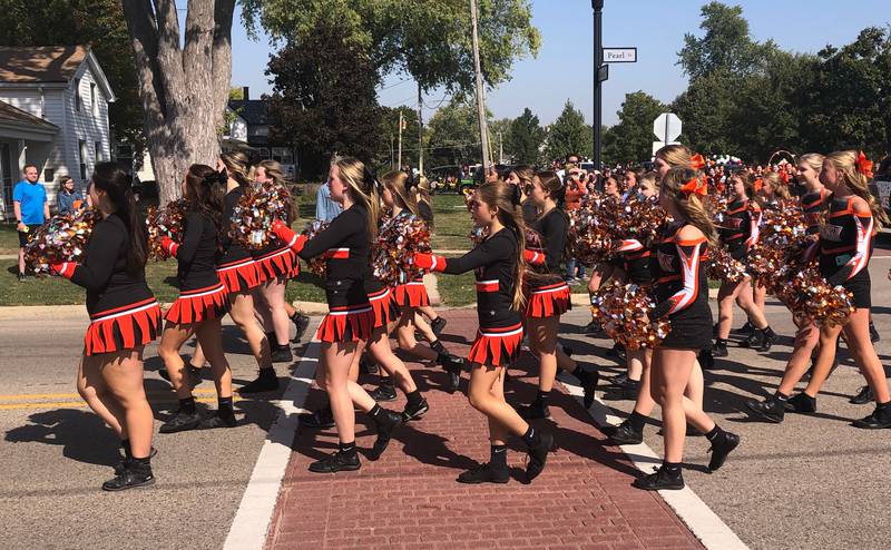 Members of the McHenry High School cheer and dance teams participate in the McHenry High School Homecoming parade Oct. 6, 2024.