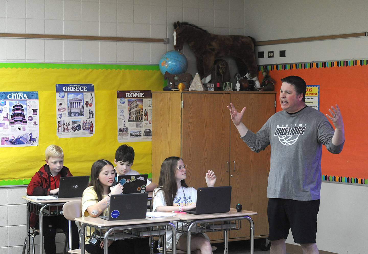Teacher Ryan Starnes talks to students Friday, April 29, 2022, as he teaches his social studies class at Marlowe Middle School. Several Huntley School District 158, classes have raised money for philanthropy causes.