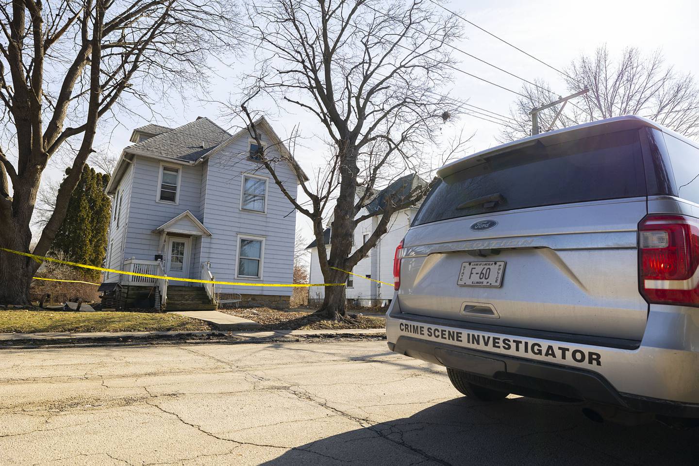 Investigators work at the scene Monday, Feb. 20, 2023 of a Sunday night shooting in the 1100 block of 4th Ave. in Sterling. One victim was pronounced dead with four taken into custody.