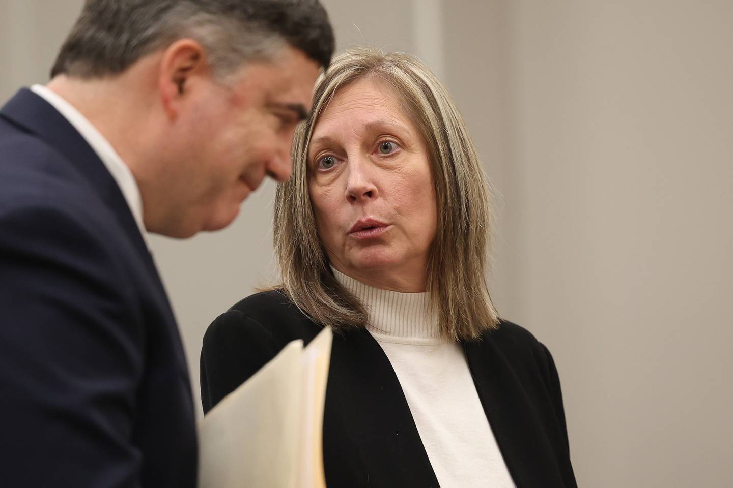 Will County Assistant State’s Attorneys Colleen Griffin talks with Jon Walters during the Drew Peterson hearing at the Will County courthouse on Monday, April 1, 2024 in Joliet.