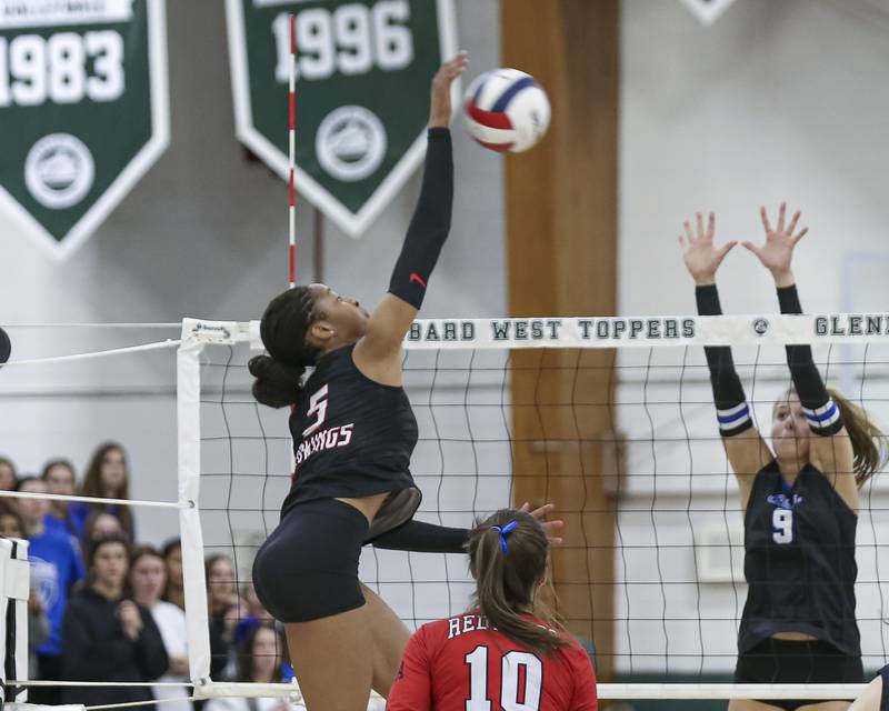 Benet's Brooklynne Brass (5) hits a kill during Class 4A Glenbard West Sectional final volleyball match between St Charles North at Benet. Nov 6, 2025 in Glen Ellyn.