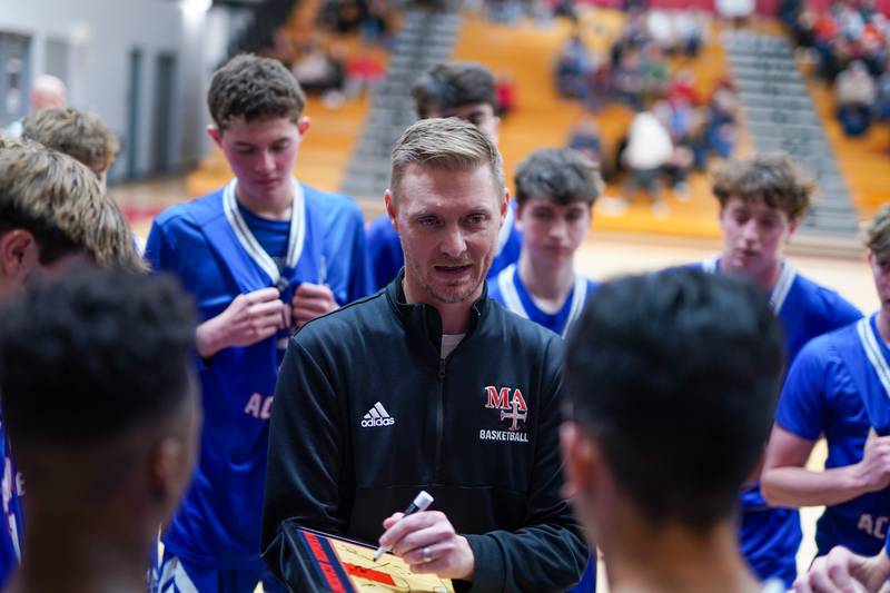 Marmion’s head coach Joe Piekarz talks to his team during a break in play against Batavia during a basketball game at Batavia High School on Wednesday, Nov. 27, 2024.