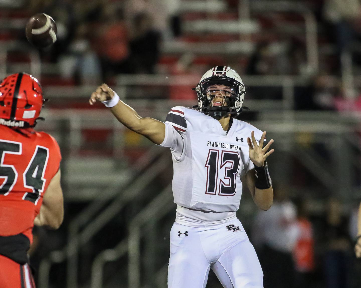 Plainfield North's Justus Byrd (13) releases a pass during a football game between Plainfield North at Bolingbrook on Friday, Oct 18th, 2024  in Bolingbrook.