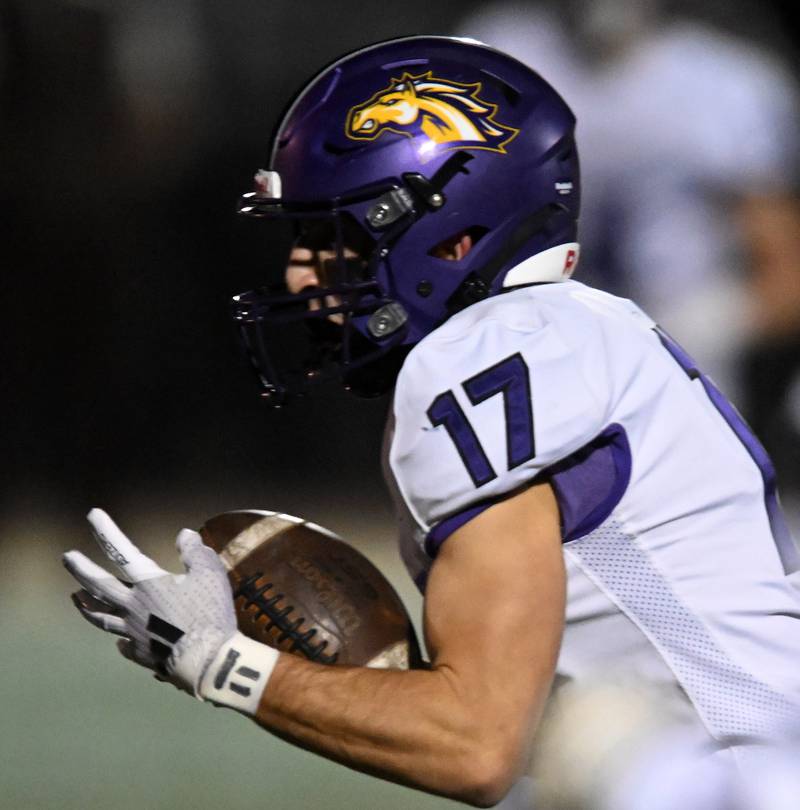 Rolling Meadows’ Matt Sansonetti catches a pass during a football game against Hersey on Friday, Oct. 18, 2024 in Arlington Heights.