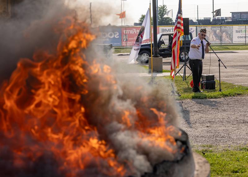 Dennis Znaniecki of the Peru Veterans Memorial Group thanks everyone of coming out and explains the importance of the annual flag retirement ceremony where retired flags are respectfully burnt on June 14, 2025 at Veteran's memorial Park in Peru.