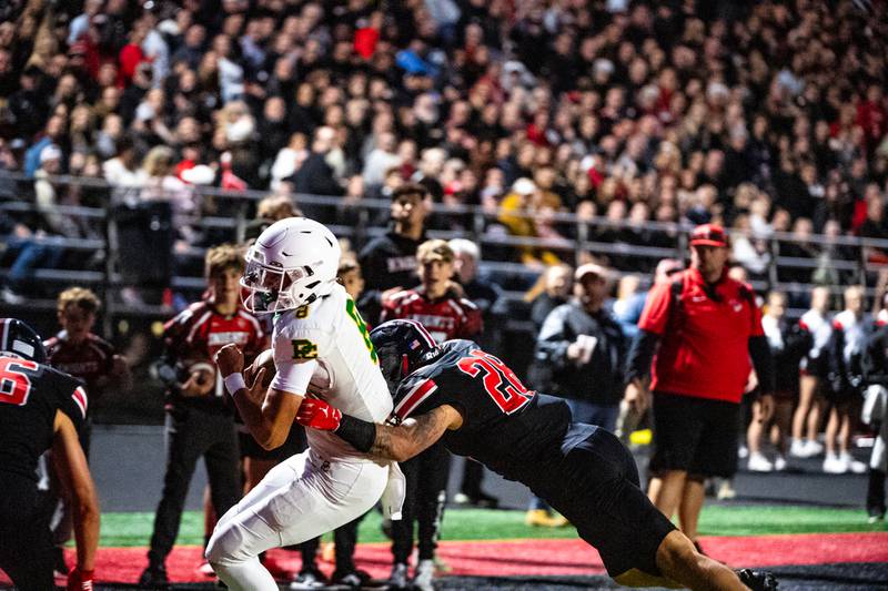 Providence's Dominic Vita is brought down by Lincoln-Way Central's Shawn Mowry, but not before scoring a touchdown during a game against on Friday Sept. 5, 2025 at Lincoln-Way Central High School in New Lenox