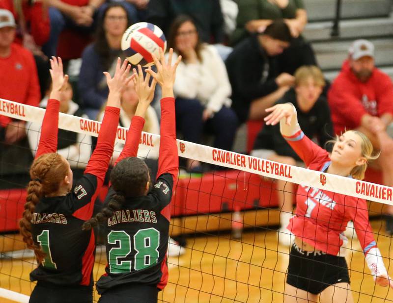 Ottawa's Ryleigh Stevenson drills a spike past L-P defenders Addison Duttlinger and Ava Currie on Tuesday, Oct. 17, 2023 at Sellett Gymnasium.