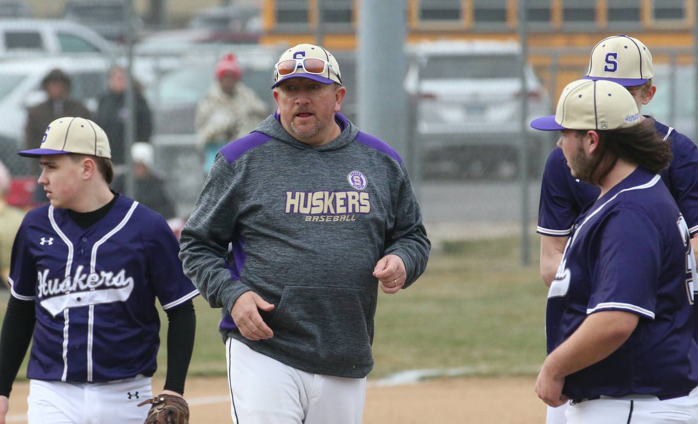Serena baseball coach Chad Baker talks strategy at the mound in a 2023 game against Ottawa at King Field.