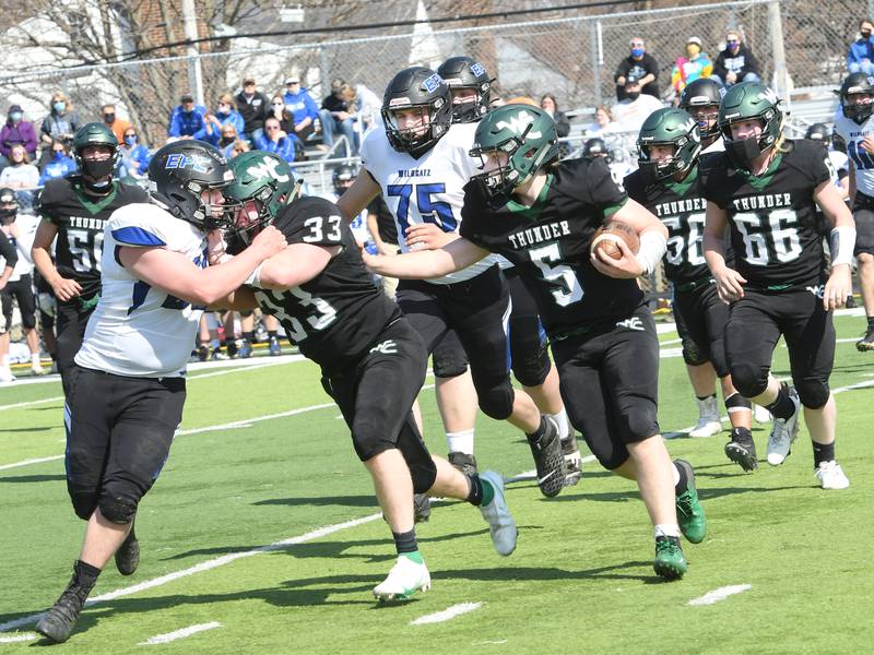 West Central's AJ Boardman follows blocker Devin Davis during Saturday, April 3, 2021, action against EPC in Freeport.