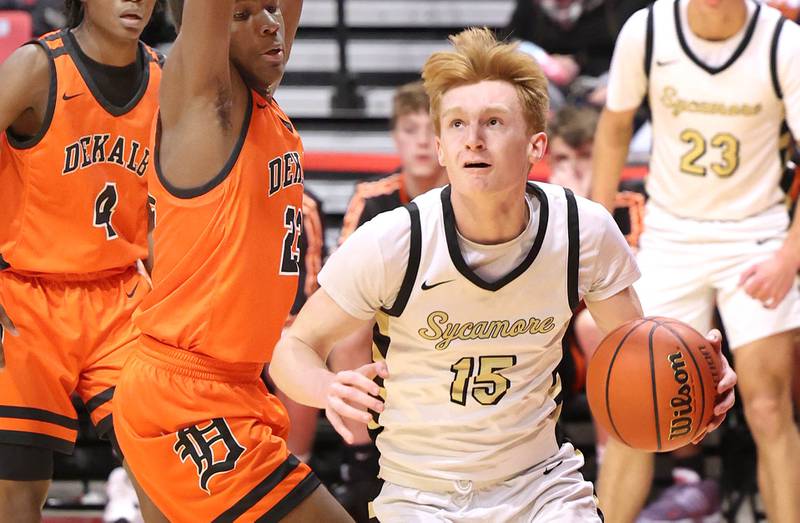 Sycamore's Teague Hallahan goes baseline against DeKalb's Davon Grant during the First National Challenge Friday, Jan. 27, 2023, at The Convocation Center on the campus of Northern Illinois University in DeKalb.