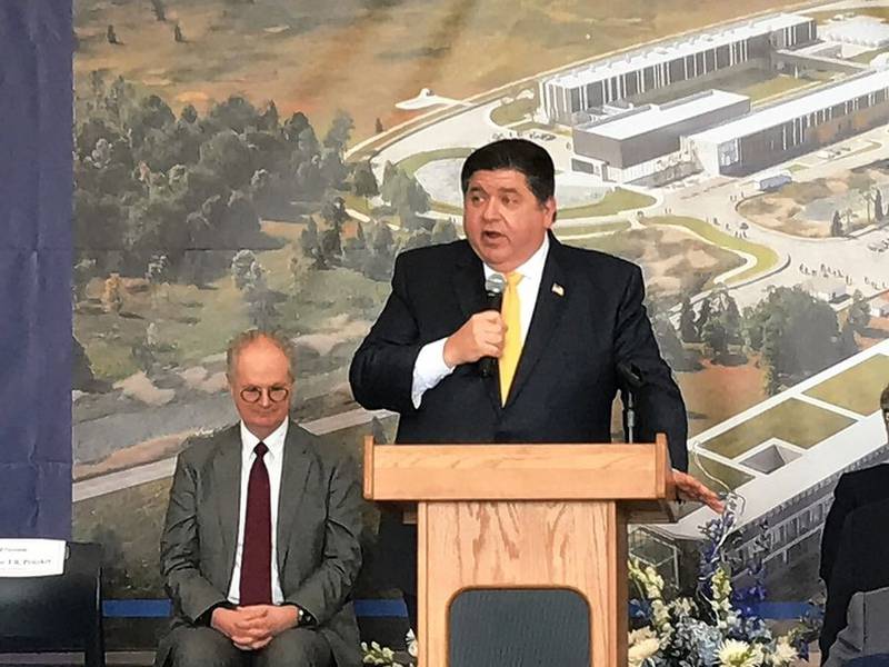 Gov. J.B. Pritzker speaks Thursday at a ceremony for the opening of two facilities and a groundbreaking for a third at Fermi National Accelerator Laboratory in Batavia.