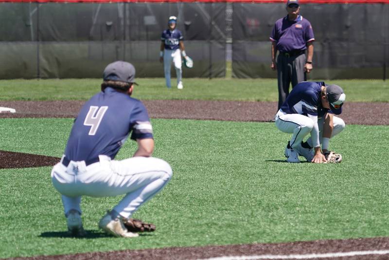 Oswego East's Will Bass (4) and Andrew Lewis (right) react after an Oswego East error in the 6th inning during a 4A Bolingbrook Regional Championship baseball game against Downers Grove North at Bolingbrook High School on Saturday, May 25, 2024.