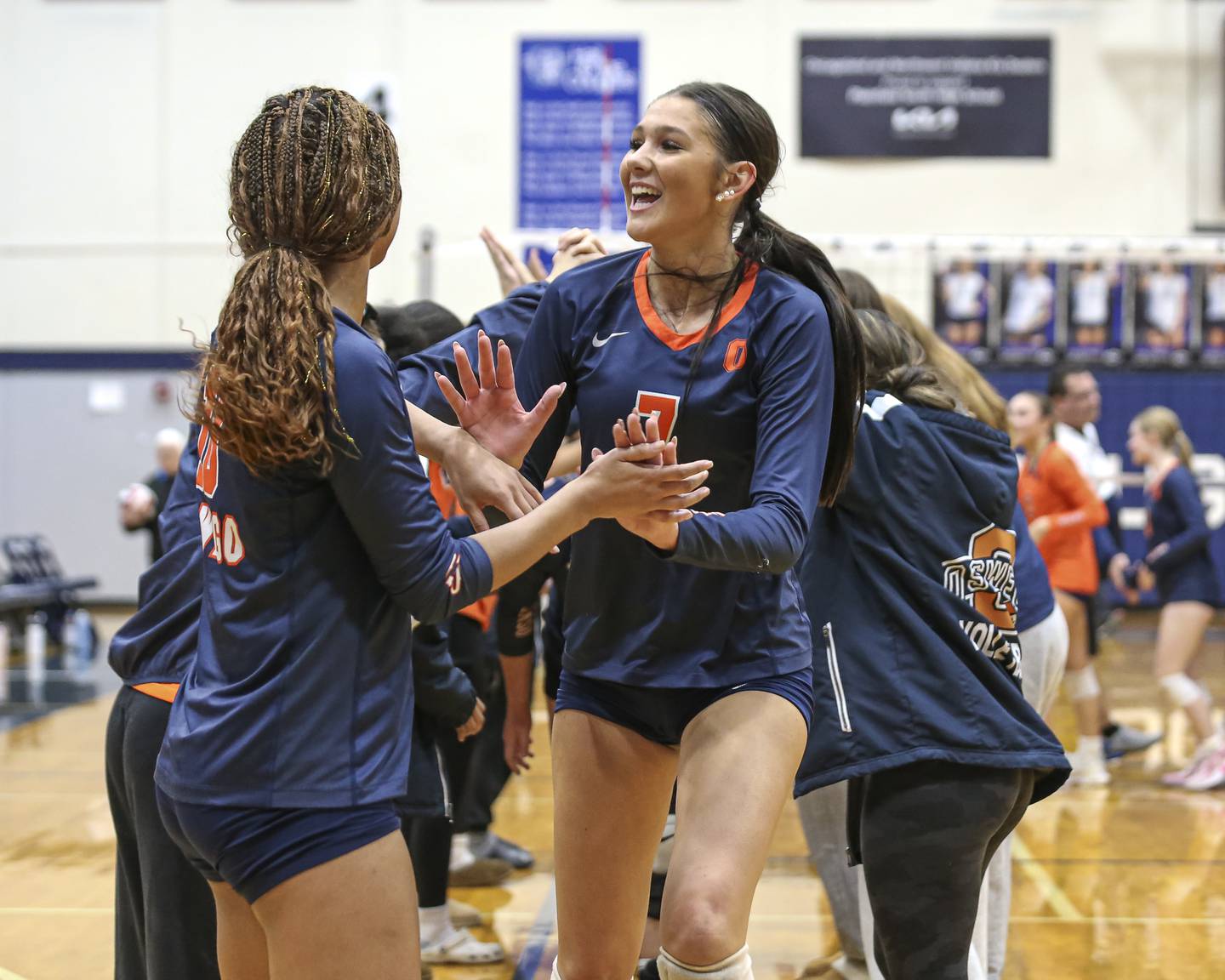 Oswego's Hannah Herrick (7) and teammates celebrate their victory over Neuqua Valley in their Class 4A Regional Final volleyball match. Oct 30, 2025 in Plainfield.