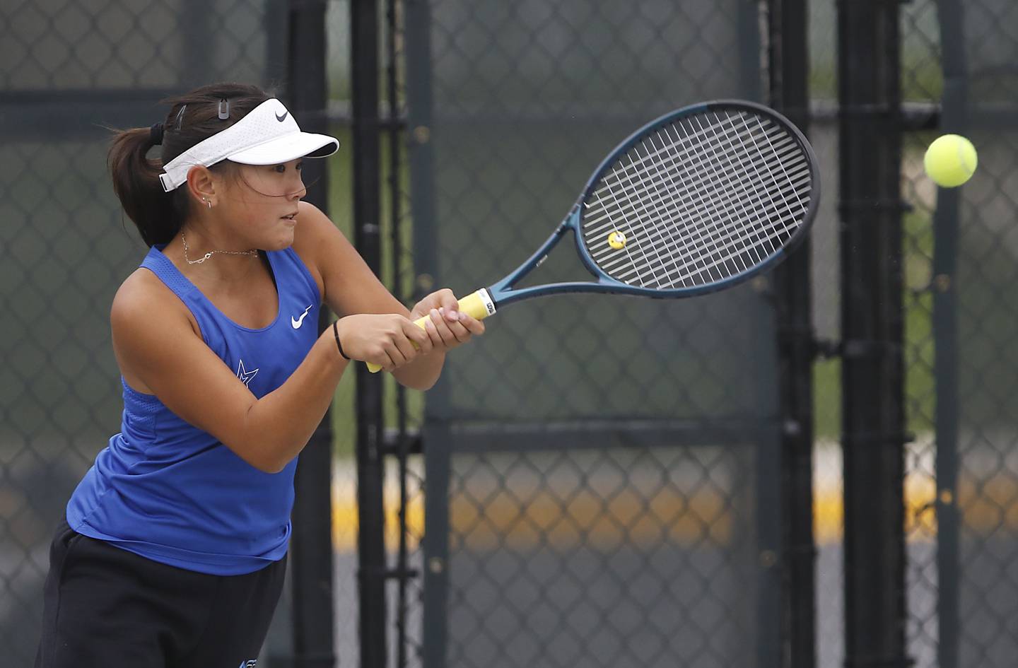 St. Charles North’s Shannon Lu returns the ball Thursday, Oct. 19, 2023, during doubles match on the first day of the IHSA State Girls Tennis Tournament at Hoffman Estates High School in Hoffman Estates.