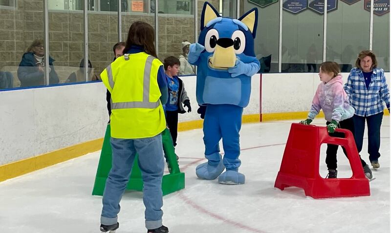 Bluey, the star of the Australian-based cartoon of the same title, glides on the ice Saturday at Ice Valley Centre Ice Arena alongside attendees of Kankakee Valley Park District's annual Winter Fest.