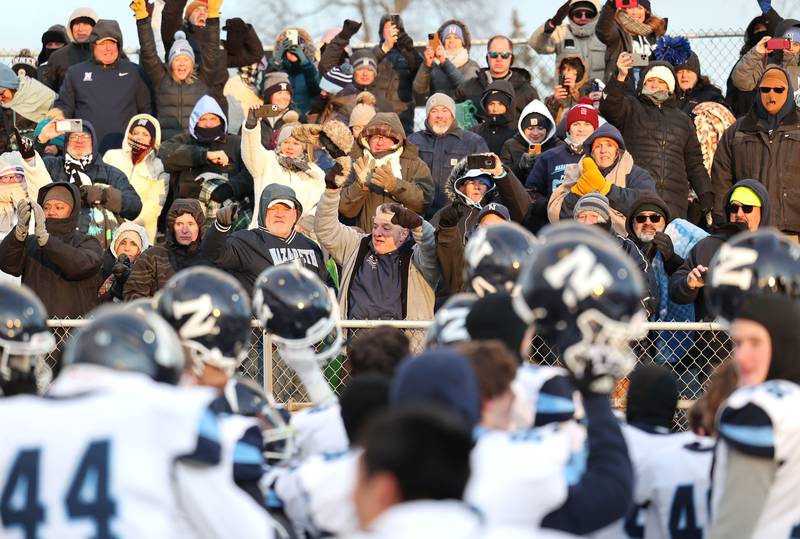 Nazareth's fans celebrate with their team after their win over Sycamore Saturday, Nov. 18, 2022, in the state semifinal game at Sycamore High School.