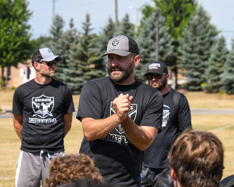 Kaneland’s varsity head football coach Michael Thorgesen talks with the team after completing a joint practice with Oswego High School on Thursday July 10, 2025, held at Oswego High School.